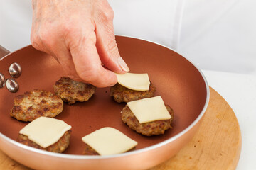 Meat burger preparation. Step by step preparation of mini burgers. Homemade mini burgers for children or appetizers. Small hamburgers.
