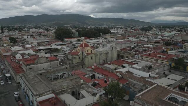 Low flight to colonial architecture of San Felipe Neri Temple, Oaxaca
