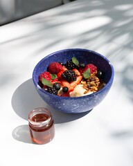fruit bowl with honey, strawberries and blackberries with oatmeal and snow, mexico latin america