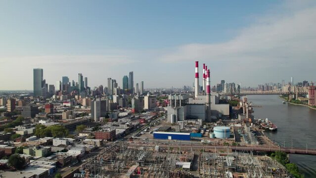 LIC and Astoria in Queens, NYC. Aerial shot with generating plant, East River, 4K.