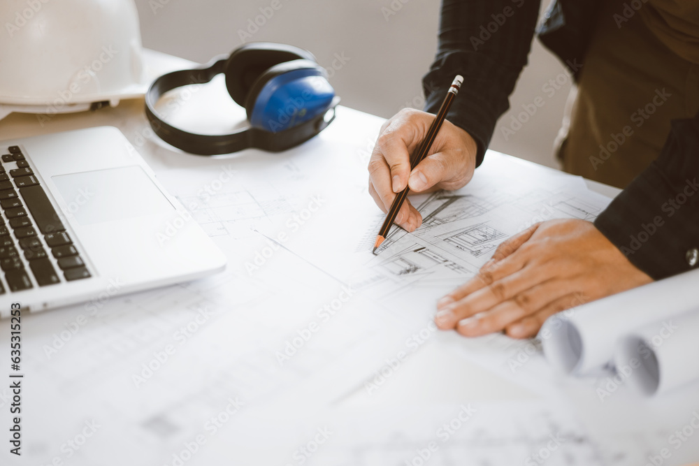 Poster architecture engineer working with blueprints and laptop in office. inspection in workplace for arch