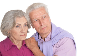 Portrait of sad senior couple isolated