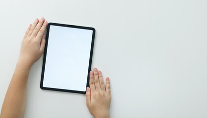 Hand of woman use finger touches with digital tablet isolated on white background. Flat lay, Top view. Concept of technology, connection, communication, social, internet of things.