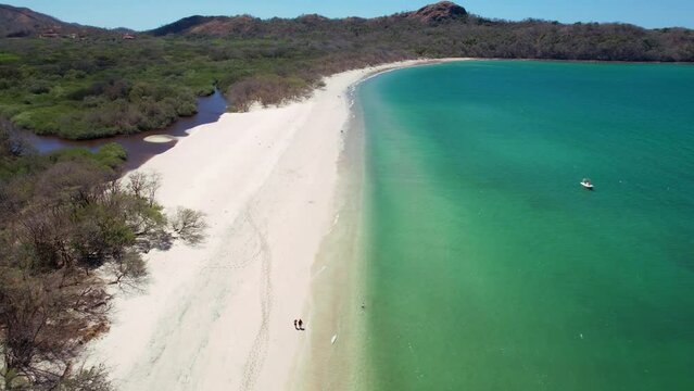 Aerial pan shot of Conchal beach in Costa Rica. Exotic beach.