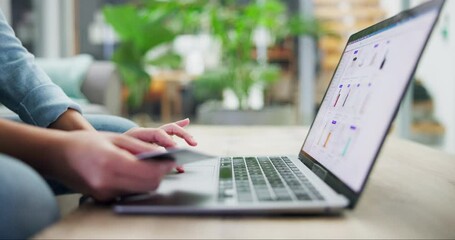 Person, laptop and hands with credit card in ecommerce, payment or banking on desk at home. Closeup of shopper with debit or typing bank details on technology or website in online shopping on table - Powered by Adobe