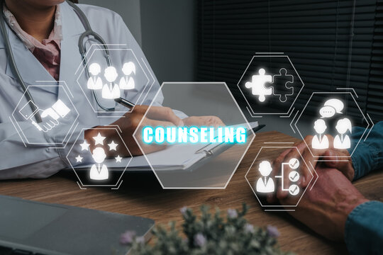 Counseling Concept, Doctor Talking To Senior Patient In Medical Practice With Counseling Icon On Virtual Screen.