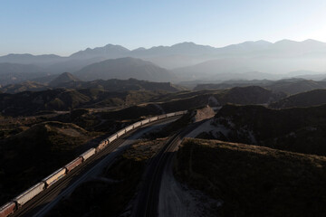 Aerial view of train in mountain landscape