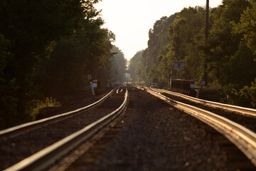 Fototapeta na wymiar Long view of train tracks vanishing into horizon