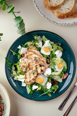 warm salad with grilled chicken and egg . restaurant menu