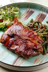 grilled pork ribs with barbecue sauce. restaurant menu