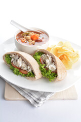 chicken tuna salad kebab open pocket bread with tomato abc soup and crispy potato chips combo healthy set in plate on white background asian halal food cuisine vegan menu for cafe design