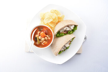 chicken tuna salad kebab open pocket bread with tomato abc soup and crispy potato chips combo healthy set in plate on white background asian halal food cuisine vegan menu for cafe design