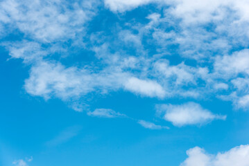 Overcast summer sky with faint sunlight.