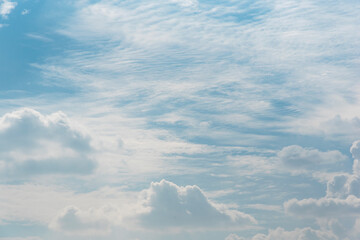 Overcast summer sky with faint sunlight.