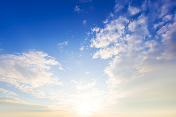 Naklejka na ściany i meble dramatic sunset on blue cloudy sky natural background