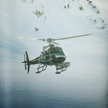 Square crop of helicopter flying in mid-air