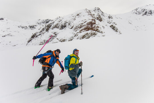 Two guys being silly while ski touring, B.C. Canada