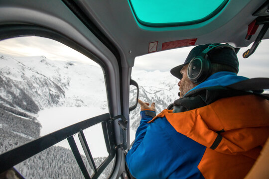 Search and rescue team looking for lost hikers from helicopter