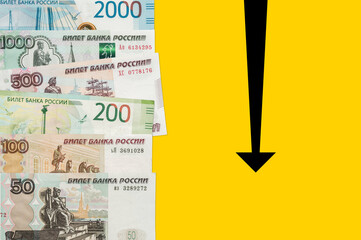 Russian rubles on a yellow background. Fall of Russian Rouble. Roubles is the currency of the Russian Federation.