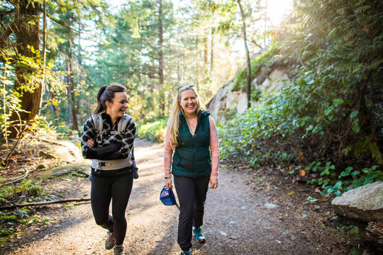 Friends, moms hike, mile and laugh together on hiking trail