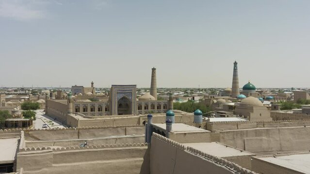 Panorama Of Itchan Kala, Walled Inner Town Of The City Of Khiva In Uzbekistan. elevated pan right
