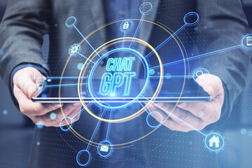 Close up of businessman hand holding tablet with glowing chat gpt hologram on blurry background. Artificial intelligence, futuristic technology and robots in online systems concept. Double exposure.