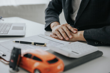 Up close shows the calculator for the cost of the car and the rental interest that must be paid. The car dealer or sales manager offers to sell the car and explains the terms of the car contract and i