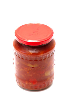 tomato paste in a jar on a white background