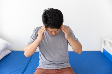 Man having a headache at home