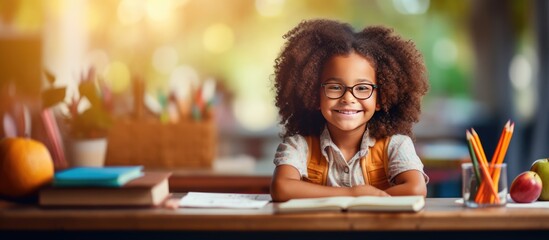 Biracial girl with diverse class at desk learning in school