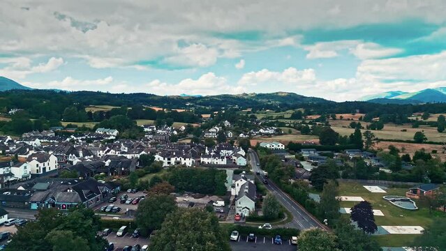Cinematic aerial drone footage of Hawkshead Village and St Michael and All Angels Church.Cumbria UK.