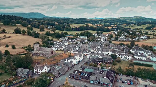 Cinematic aerial drone footage of Hawkshead Village and St Michael and All Angels Church.Cumbria UK.