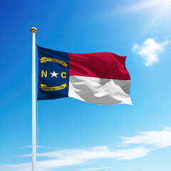 Waving flag of North Carolina is a state of United States on flagpole