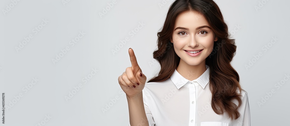 Poster a confident brunette woman standing smiling and pointing in different directions against a white bac
