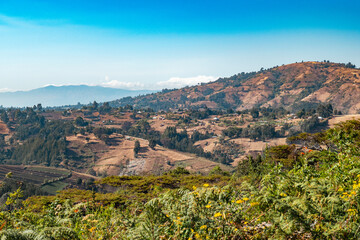 Fototapeta na wymiar Scenic view of a valley against sky at Mbeya Peak, Tanzania