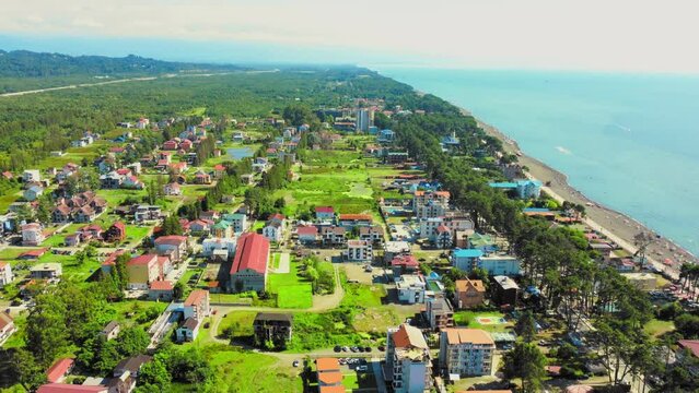 Drone drone over beach Black Magnetic Sands in Ureki and Magnetiti. Mountains and Georgian village of Ureki in place where tourists rest. Black Sea coast with black magnetic sands.