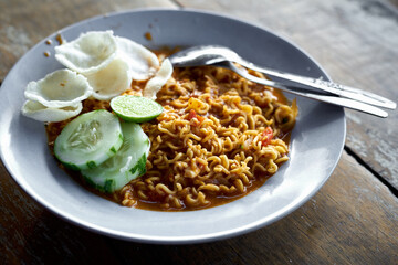 Asian Fried Noodles on wooden table at Street food markets, Top View