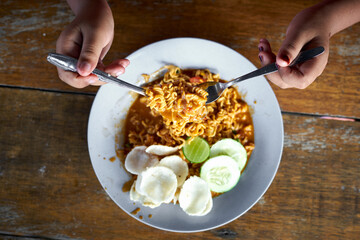 Asian Fried Noodles on wooden table at Street food markets, Top View