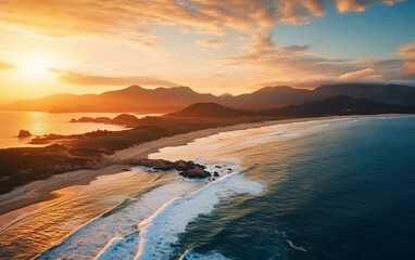 Fototapeta premium Aerial beautiful shot of a seashore with hills on the background at sunset
