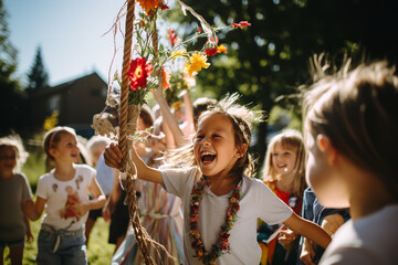 Joyful children in colorful outfits whirl around a maypole, embracing the fun and traditions of birthday celebrations - obrazy, fototapety, plakaty