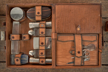 Vintage wooden box with various barber tools