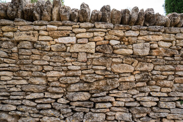 View of dry stone wall in the village of Gordes, Vaucluse, Provence, France, High quality photo