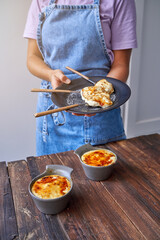 Crop woman with delicious fried dessert