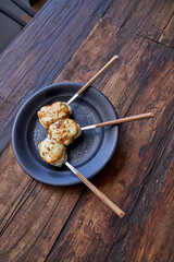 Plate with delicious dessert on wooden table