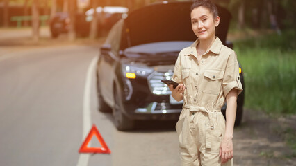 Brunette woman driver looks with excited expression after calling tow truck to place of accident. Businesswoman waits for car service on roadside, sunlight