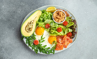 Fototapeta na wymiar Healthy eating food vegetables salad, avocado, fish, eggs, nuts peanut paste. low carb keto ketogenic diet. Long banner format. top view