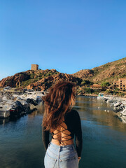 Woman look at the sea in the evening