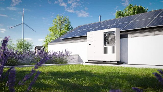 Green roof with grass covering and an installed heat pump with photovoltaic panels on the roof of a single-family house. An ecological source of heating and air conditioning for the property.