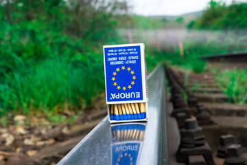 Matches on rails railroad tracks background, fire on railways concept