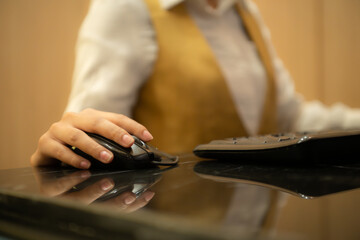Asian ticket seller at the box office with the service of selling movie tickets to movie audiences in each round